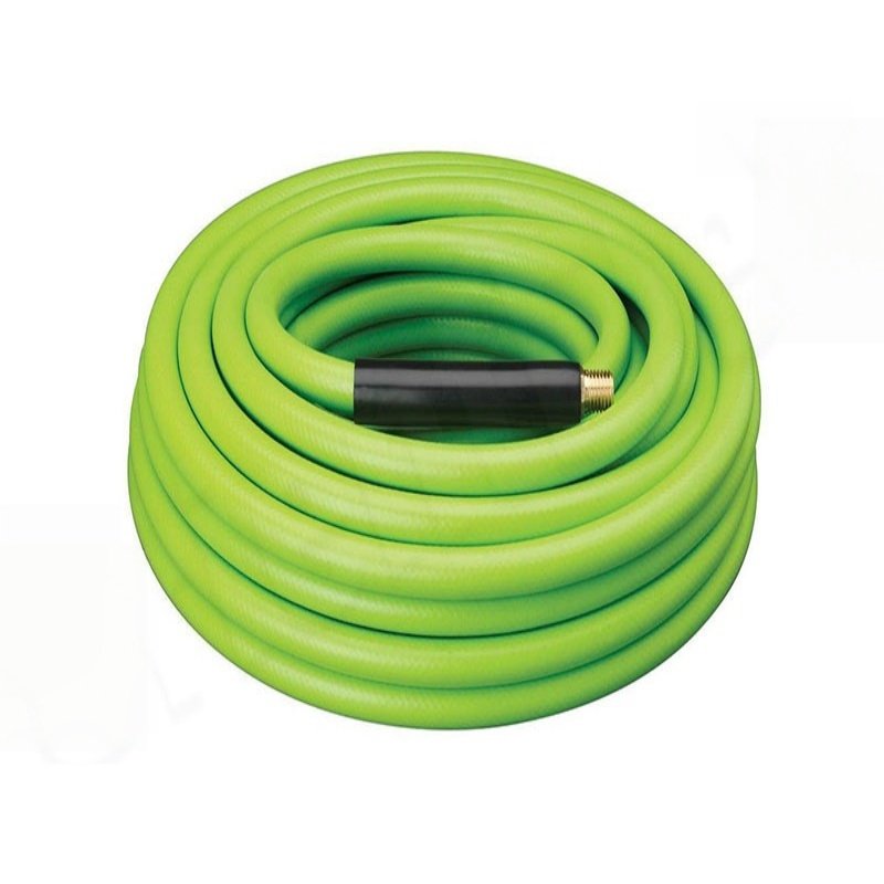 Yellow hybrid air hose with black reinforced ends and brass fittings, showing coiled appearance and flow direction arrow