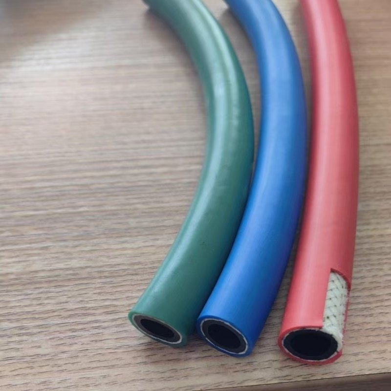 Red and green cotton braided spray hose (showing the hose structure, including PVC inner layer and cotton braided reinforcement layer
